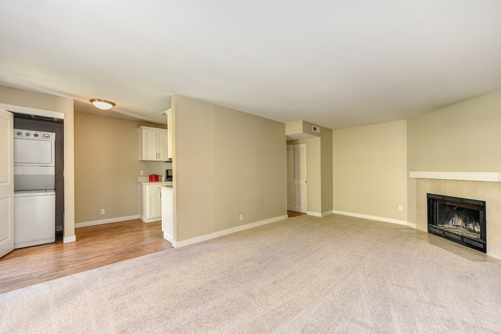 Vacant Kelsey and Mercer Floorplan Living and Dining Area with Fireplace & Stackable W/D Closet in Select Homes 